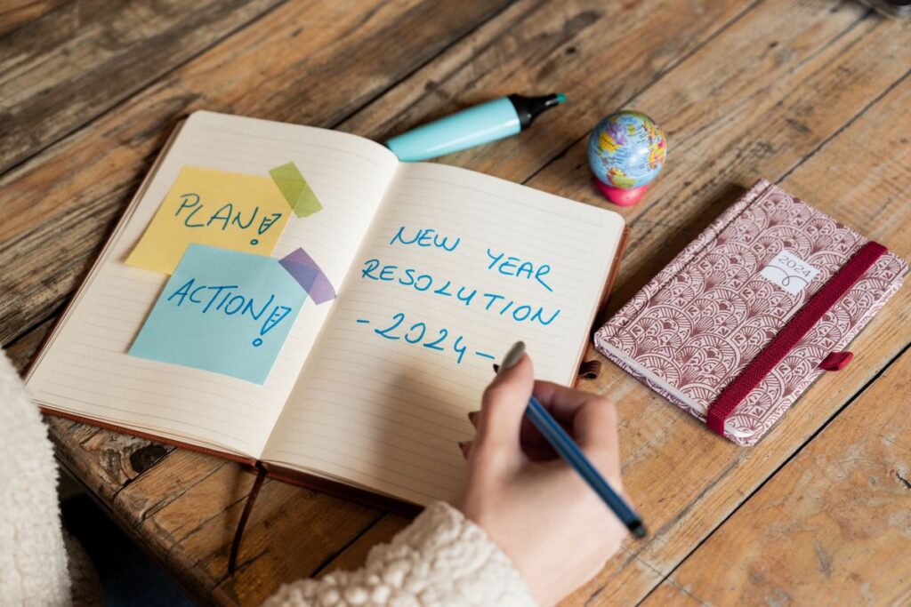 The Goal-Setting Trap: Why Most Goals Fail Before You Even Start Person writing goals and plans in a notebook
